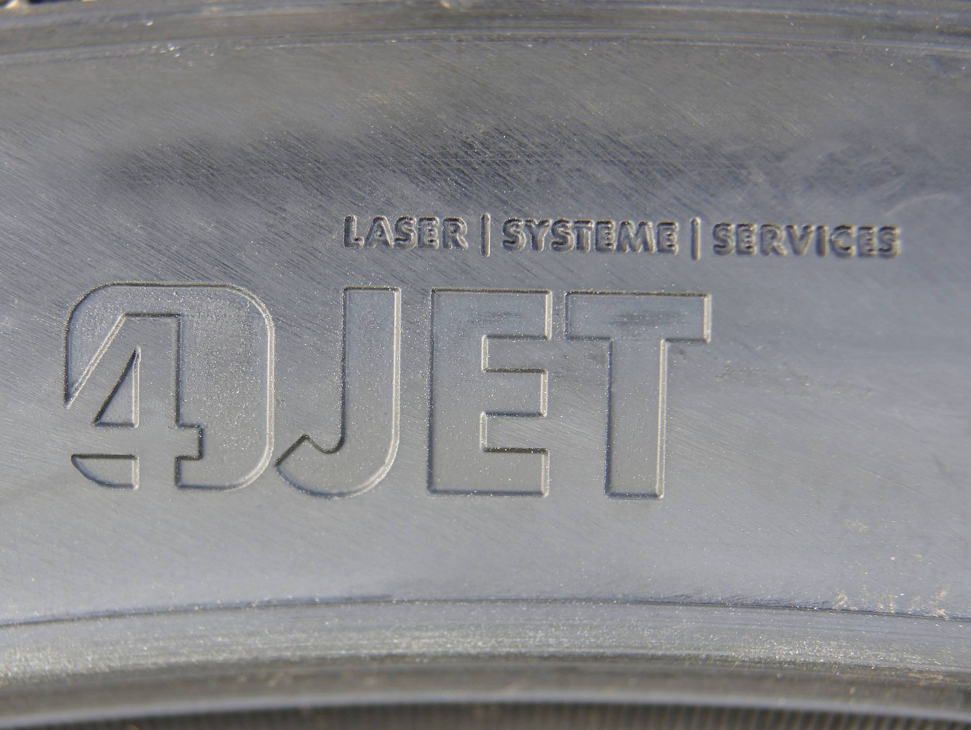 Laser engraved company logo on a tire sidewall Laser engraved company logo on a tire sidewall